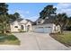 Stunning home featuring a three-car garage, arched windows, and a large driveway for easy parking at 400 Summerwood Ct., Myrtle Beach, SC 29579