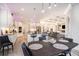 Open-concept kitchen with white cabinets, stainless steel appliances, and an island with bar seating at 400 Summerwood Ct., Myrtle Beach, SC 29579