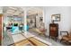 Stylish living area with modern furniture, coffered ceiling, and view of the lake at 400 Summerwood Ct., Myrtle Beach, SC 29579