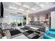 Spacious living room features a coffered ceiling, modern fireplace, and scenic views, creating a cozy atmosphere at 400 Summerwood Ct., Myrtle Beach, SC 29579