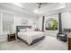 Spacious main bedroom featuring a tray ceiling, neutral tones, and large windows at 400 Summerwood Ct., Myrtle Beach, SC 29579