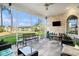 Screened patio with beautiful lake views, brickwork, and comfortable seating creating an inviting outdoor space at 400 Summerwood Ct., Myrtle Beach, SC 29579