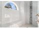 Luxurious walk-in shower featuring marble tiles, a built-in bench, and a large window at 400 Summerwood Ct., Myrtle Beach, SC 29579