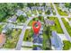 Aerial view showcases a community with manicured lawns, mature trees, and varied home styles at 405 Flagstone Dr., Myrtle Beach, SC 29588
