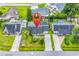 Aerial view of a home with well-maintained lawn, driveways, and nearby homes at 405 Flagstone Dr., Myrtle Beach, SC 29588