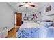 Cozy bedroom with hardwood floors, ceiling fan, and a comfortable bed at 405 Flagstone Dr., Myrtle Beach, SC 29588