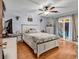 Bright bedroom with hardwood floors, ceiling fan, and sliding glass doors to the patio at 405 Flagstone Dr., Myrtle Beach, SC 29588