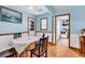 Bright dining room with wood floors, wainscoting, and a table set for a meal at 405 Flagstone Dr., Myrtle Beach, SC 29588