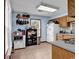 Kitchen with tiled floors, white appliances, and ample storage space at 405 Flagstone Dr., Myrtle Beach, SC 29588