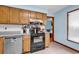 Kitchen area with wood cabinets and black stove at 405 Flagstone Dr., Myrtle Beach, SC 29588
