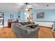 Living room featuring hardwood floors, light blue walls, and vaulted ceilings at 405 Flagstone Dr., Myrtle Beach, SC 29588