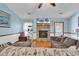 Comfortable living room with a stone fireplace, and cozy seating at 405 Flagstone Dr., Myrtle Beach, SC 29588