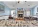 Inviting living room features stone fireplace and tv at 405 Flagstone Dr., Myrtle Beach, SC 29588
