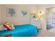 Well-lit bedroom featuring a dresser and a twin bed, leading to a bathroom at 4142 Hibiscus Dr. # 20-202, Little River, SC 29566