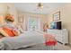 Bright bedroom featuring a queen-sized bed, white furniture, and ample natural light from the window at 4142 Hibiscus Dr. # 20-202, Little River, SC 29566