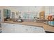 Shows the kitchen countertop with a view to the open plan living area with views to the outdoors at 4142 Hibiscus Dr. # 20-202, Little River, SC 29566