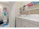 Efficient laundry room with modern washer and dryer, shelving and plenty of room for storage at 4142 Hibiscus Dr. # 20-202, Little River, SC 29566