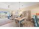 Bright living and dining area with wood floors and ample natural light at 4142 Hibiscus Dr. # 20-202, Little River, SC 29566