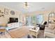 Open-concept living area with a large TV and access to an outdoor balcony at 4142 Hibiscus Dr. # 20-202, Little River, SC 29566