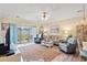 Comfortable living room with sliding glass doors to the outdoor area at 4142 Hibiscus Dr. # 20-202, Little River, SC 29566