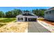 Charming one-story home with gray siding, concrete driveway and attached garage in a serene neighborhood at 420 Meadow Sweet Pl, Conway, SC 29526