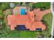 Aerial view of a stunning estate with pool, palm trees, and a red tile roof at 434 Posada Dr., Myrtle Beach, SC 29572