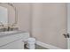 Stylish powder room with marble countertop, decorative mirror, and modern fixtures at 434 Posada Dr., Myrtle Beach, SC 29572