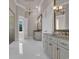 Spacious bathroom featuring double sinks with marble countertops and white cabinets at 434 Posada Dr., Myrtle Beach, SC 29572