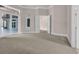 Spacious bedroom with carpeted floors, a view of the outside, and bright natural lighting at 434 Posada Dr., Myrtle Beach, SC 29572