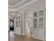 Open entryway with large chandeliers and tile flooring throughout the house at 434 Posada Dr., Myrtle Beach, SC 29572