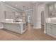 Open kitchen showcasing a large island, stainless steel appliances, and tile flooring at 434 Posada Dr., Myrtle Beach, SC 29572