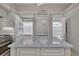 Open refrigerator doors next to kitchen island featuring a marble countertop at 434 Posada Dr., Myrtle Beach, SC 29572