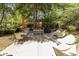 Outdoor patio with dining and lounge furniture amidst lush greenery, perfect for relaxing and entertaining at 4370 Crepe Myrtle Ct. # F, Murrells Inlet, SC 29576