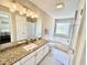 Bathroom featuring a sink with granite counters, a toilet, and a tub with jets at 4370 Crepe Myrtle Ct. # F, Murrells Inlet, SC 29576