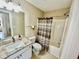 Bathroom featuring a sink with granite counters, a toilet, and a shower-tub combination at 4370 Crepe Myrtle Ct. # F, Murrells Inlet, SC 29576