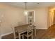 Dining room featuring a simple table set under a pendant light, with access to hallway at 4370 Crepe Myrtle Ct. # F, Murrells Inlet, SC 29576