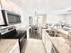 Well-lit kitchen with stainless steel appliances and an open view to living and dining areas at 4370 Crepe Myrtle Ct. # F, Murrells Inlet, SC 29576