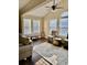 Bright sunroom with high ceilings, large windows, and comfortable seating area at 4370 Crepe Myrtle Ct. # F, Murrells Inlet, SC 29576