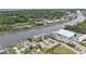 Aerial view of community nestled along the waterway, showcasing waterfront living and amenities at 4445 Kingsport Rd. # 101, Little River, SC 29566