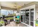 Covered balcony with outdoor seating, plants, and water views at 4445 Kingsport Rd. # 101, Little River, SC 29566