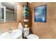 Charming bathroom with textured walls, decorative towels, and a well-lit mirror, creating a cozy and stylish space at 4445 Kingsport Rd. # 101, Little River, SC 29566