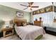 Cozy bedroom with a rattan headboard, tropical accents, and soft lighting, creating a relaxing and inviting space at 4445 Kingsport Rd. # 101, Little River, SC 29566
