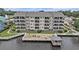 Beautiful condo complex with a wooden patio that extends over the water with furniture for relaxing and taking in the views at 4445 Kingsport Rd. # 101, Little River, SC 29566