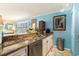 Well-appointed kitchen with granite counters, stainless steel appliances, and blue accent wall at 4445 Kingsport Rd. # 101, Little River, SC 29566
