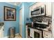 Modern kitchen with stainless steel appliances, mosaic backsplash, and ample cabinet space at 4445 Kingsport Rd. # 101, Little River, SC 29566