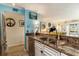Open kitchen featuring granite countertops, stainless steel appliances, and a double sink at 4445 Kingsport Rd. # 101, Little River, SC 29566