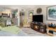 Comfortable living room offering a fireplace, flatscreen TV and bar seating at 4445 Kingsport Rd. # 101, Little River, SC 29566