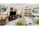 Comfortable living room with fireplace, TV, and sliding glass doors leading to a balcony at 4445 Kingsport Rd. # 101, Little River, SC 29566