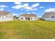 Expansive backyard featuring a well-manicured lawn and white picket fence at 447 Honeyhill Loop, Conway, SC 29526