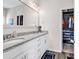 Bathroom featuring double vanity with granite countertop and a view of closet at 447 Honeyhill Loop, Conway, SC 29526